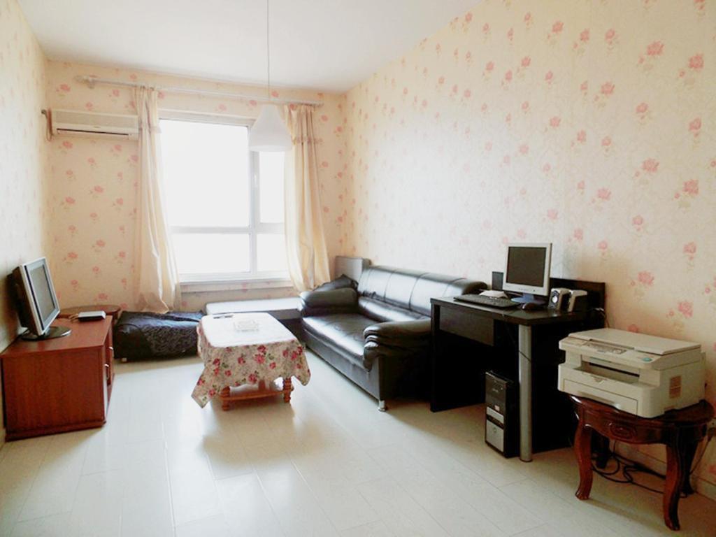 Xinghai Zhilian Apartment Далиен Стая снимка
